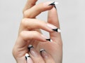 Fall 2022 nail trends include contrasting french manicures, one of fall 2022's new nail art trends.