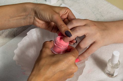 Everything to know about giving yourself a dip powder manicure at home, including prepping, applying...