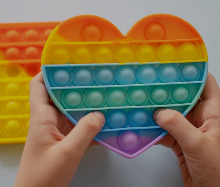 colorful antistress sensory toy fidget push pop it in kid's hands