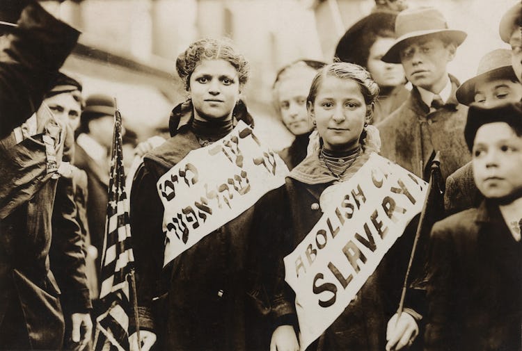 New York City May Day celebration of the international labor day. Two girls in the parade combined c...