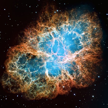 Detailed image of the Crab Nebula in the constellation Taurus, blue and orange colors, elements of this image provided by NASA.