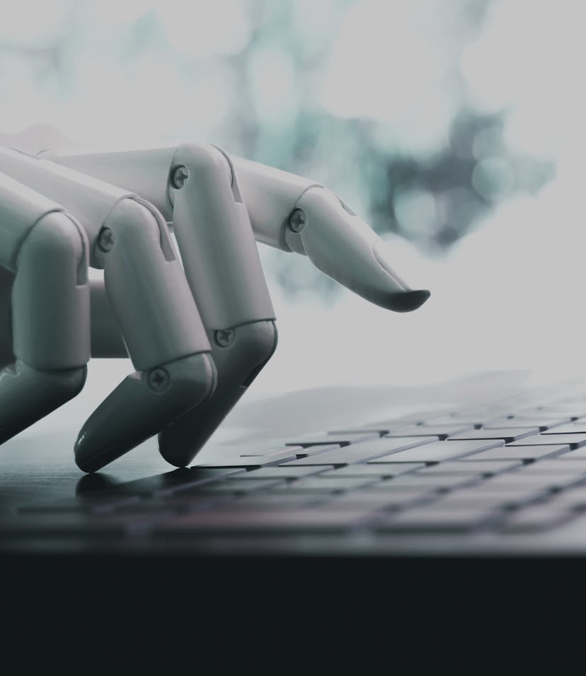 Robot concept or robot hand chatbot pressing computer keyboard enter