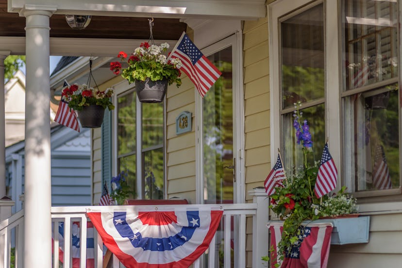 American colonial house exterior decorated for fourth of July