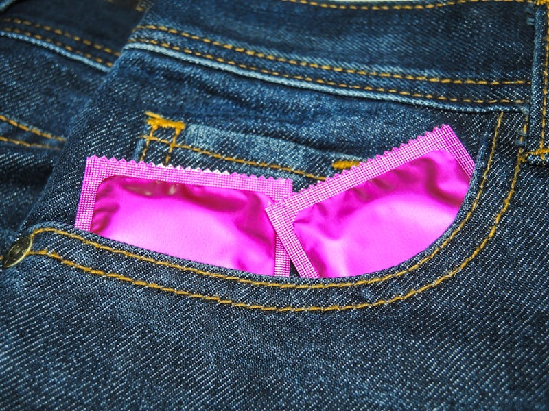 Condoms for sex.Jeans background.A good image to use.Close shot.