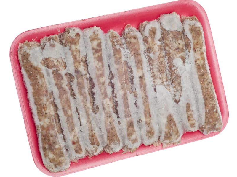 Frozen Pork Sausage Links with Frost Isolated on White with a Clipping Path.