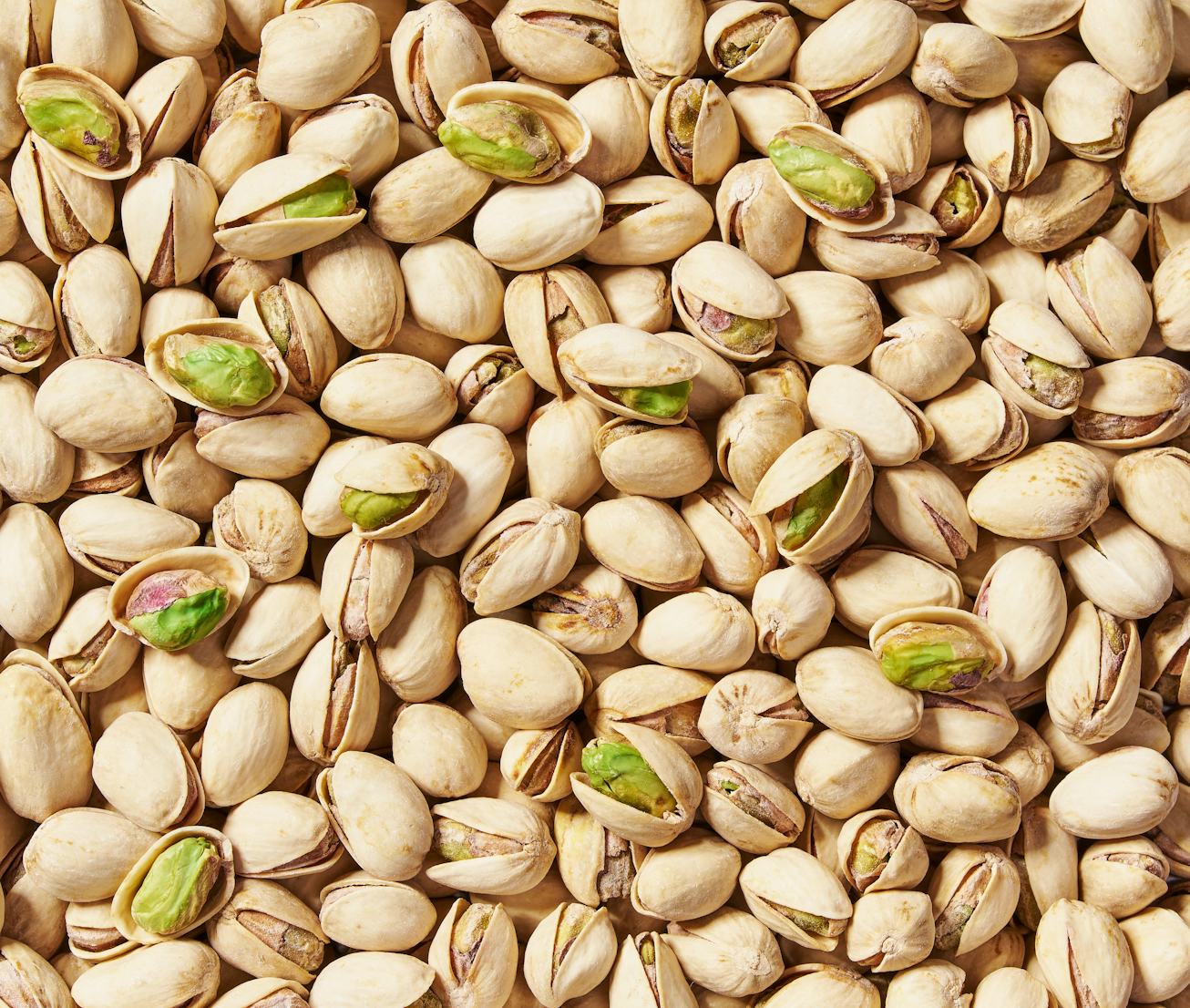 Pistachios texture and background . Tasty pistachios as background,as pistachios texture. flat lay