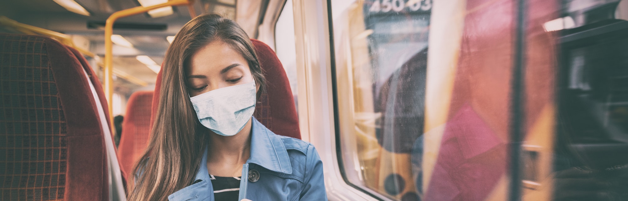Face mask concept. Woman wearing mandatory mask inside public spaces for transport such as train sta...