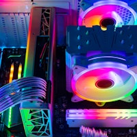 Inside view of custom colorful illuminated bright rainbow RGB LED gaming pc.. Computer power hardwar...