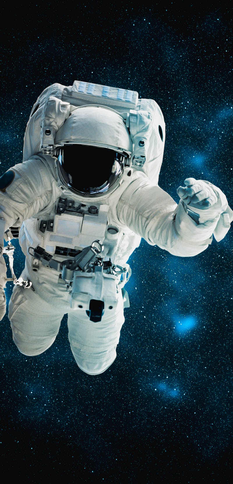 Astronaut spaceman doing spacewalk while working for space station in outer space
