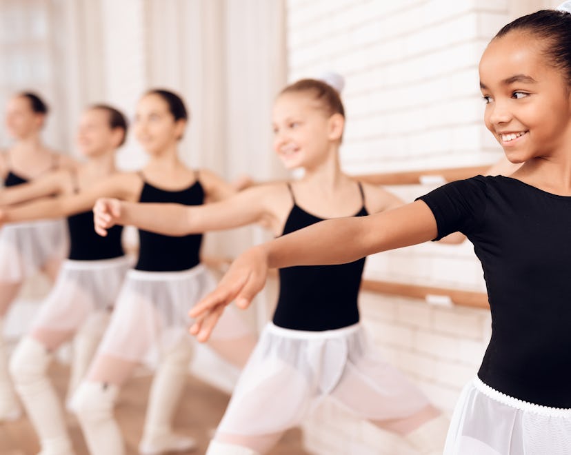 Young ballerinas rehearsing in the ballet class; extracurricular activities for kids