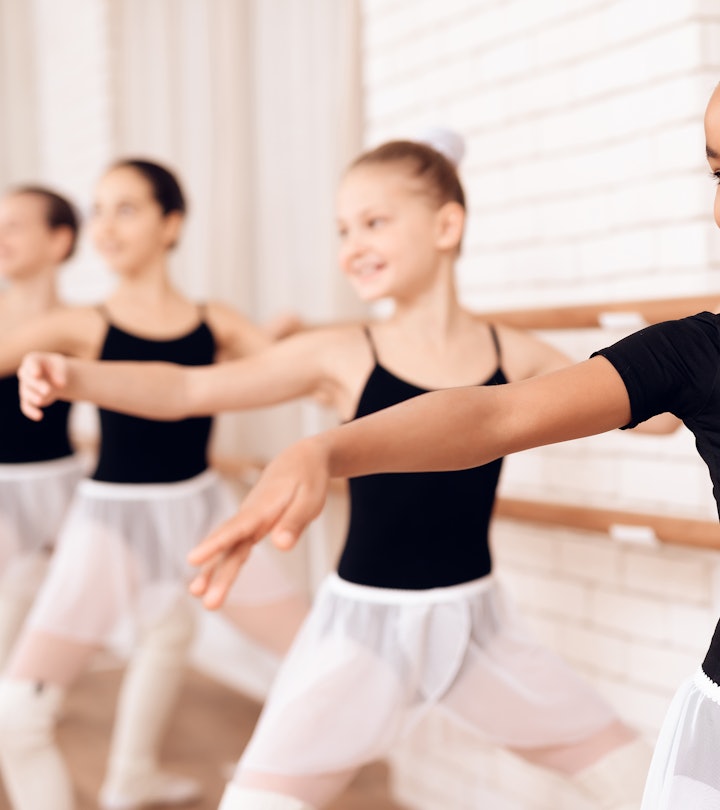 Young ballerinas rehearsing in the ballet class. They perform different choreographic exercises. The...