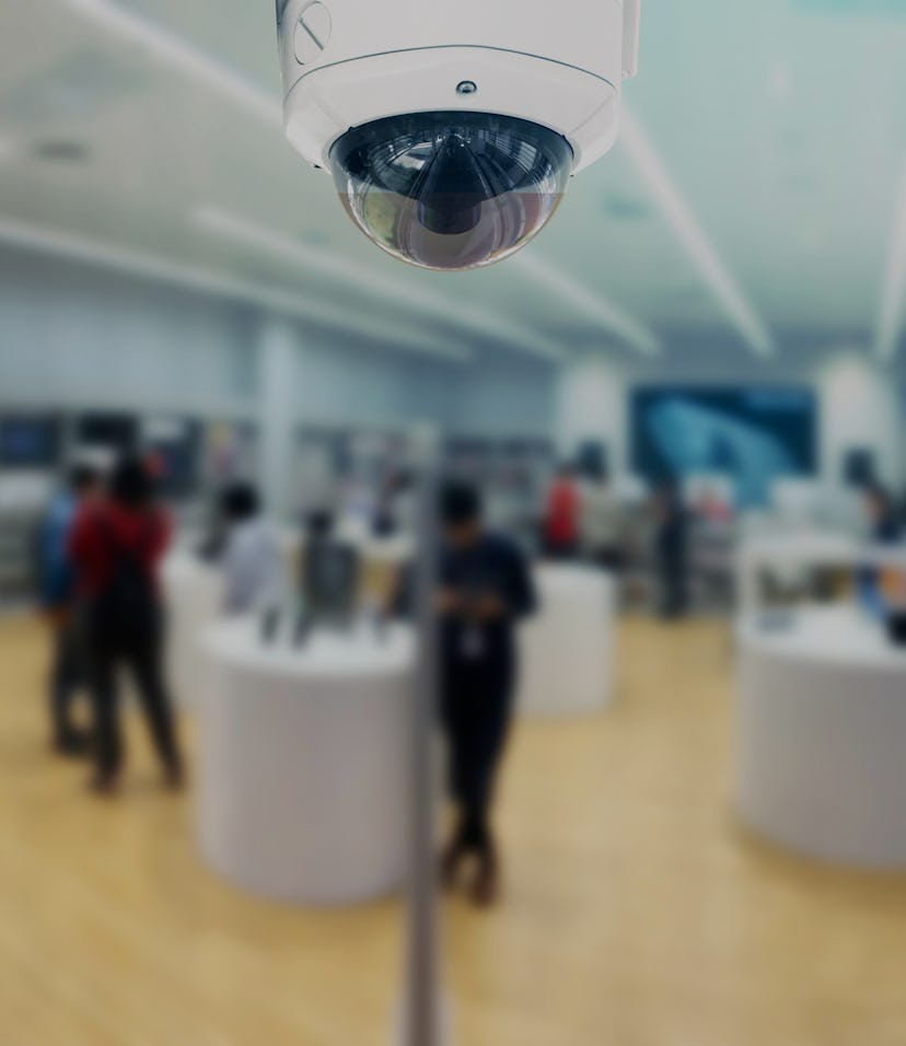 CCTV security panorama with shop store blurry background.