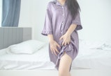 woman wearing a purple nightshirt in article about why is my vagina itchy