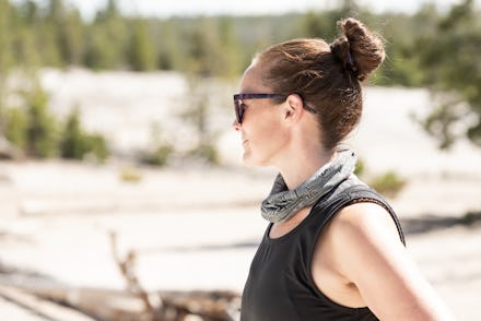 Woman with Sunglasses Looks Out over Yellowstone Geyser Basin