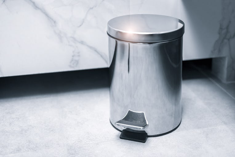 Trash bin in a bathroom, cleaning concept