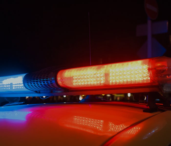 Red light flasher atop of a police car.