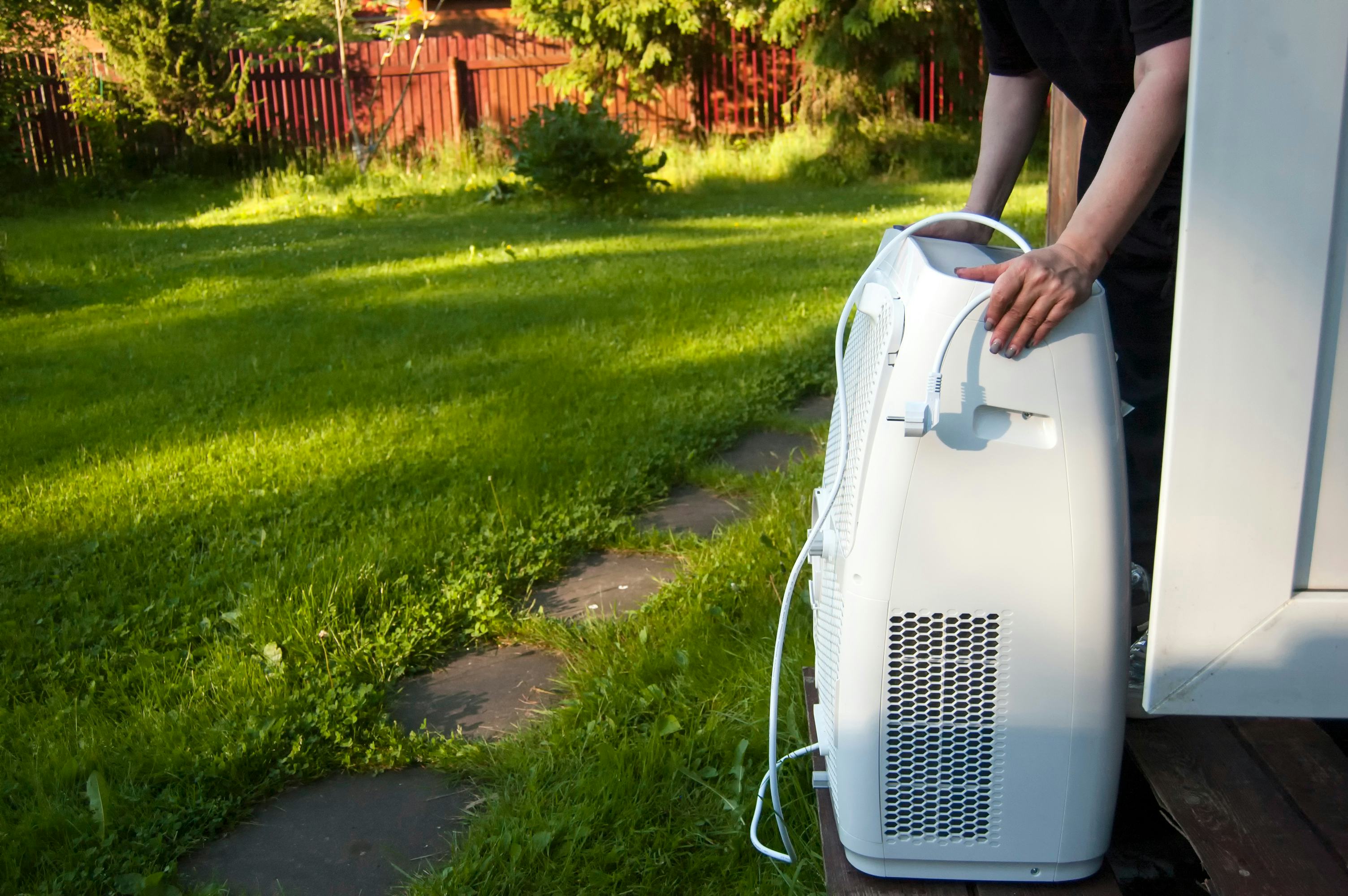 Portable air conditioner for detached garage workshops