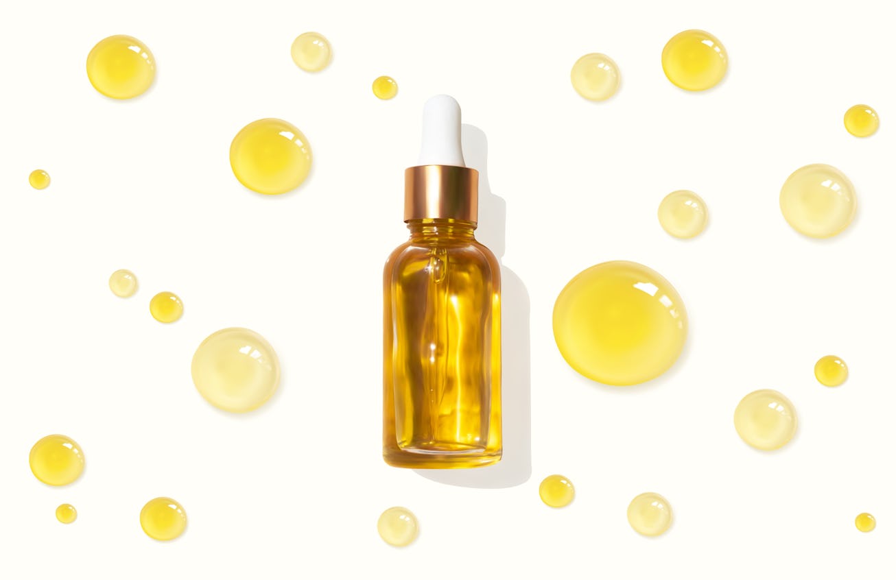 Oil serum glass bottle and collagen drops realistic vector illustration, top view. Aromatherapy oil....