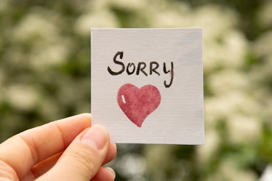 Sorry. Sticker with sorry inscription and red heart. I'm sorry lettering