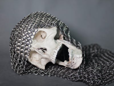 The human skull in the chainmail hood. The remains of a fallen warrior. Death.