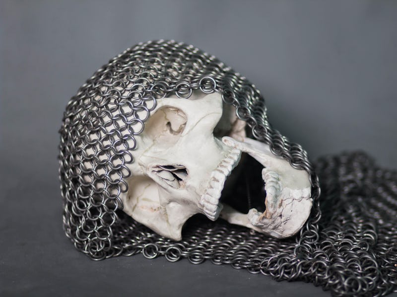 The human skull in the chainmail hood. The remains of a fallen warrior. Death.