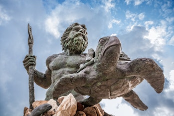 King Neptune statute, famous tourist attraction at Virginia Beach, against a cloudy sky