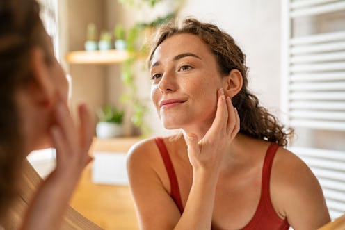 Young lady that using Retinol on her face