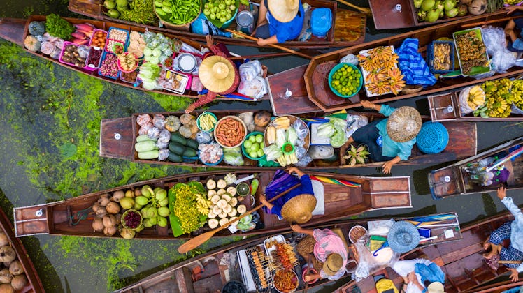 Aerial view famous floating market in Thailand, Damnoen Saduak floating market, Farmer go to sell or...