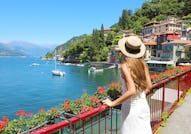 Holidays on Lake Como. Back view of beautiful fashion girl enjoying view of the Walk of Lovers in Va...