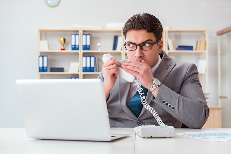 Businessman leaking confidential information over phone