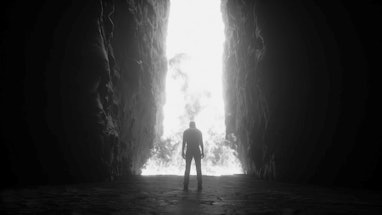 Sinner. A lonely sinfull man stands in front of a hell gates. Hell fire. Religious concept. 3d rende...