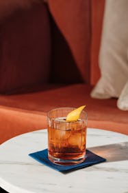Negroni, an italian IBA cocktail with gin, bitter and vermouth; in luxury elegant home, homemade dri...