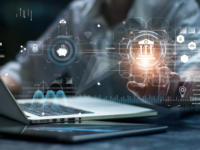 Businessman using laptop and touching icon banking on network connection. Digital marketing. Finance...