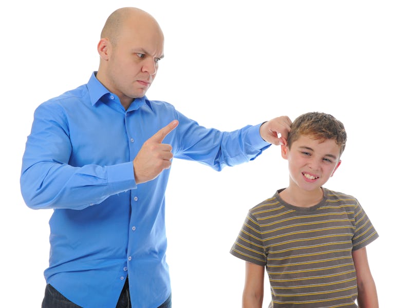 Strict father punishes his son. Isolated on white background