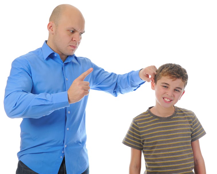 Strict father punishes his son. Isolated on white background