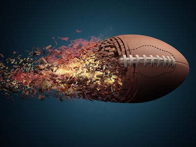  American football ball in fire flying