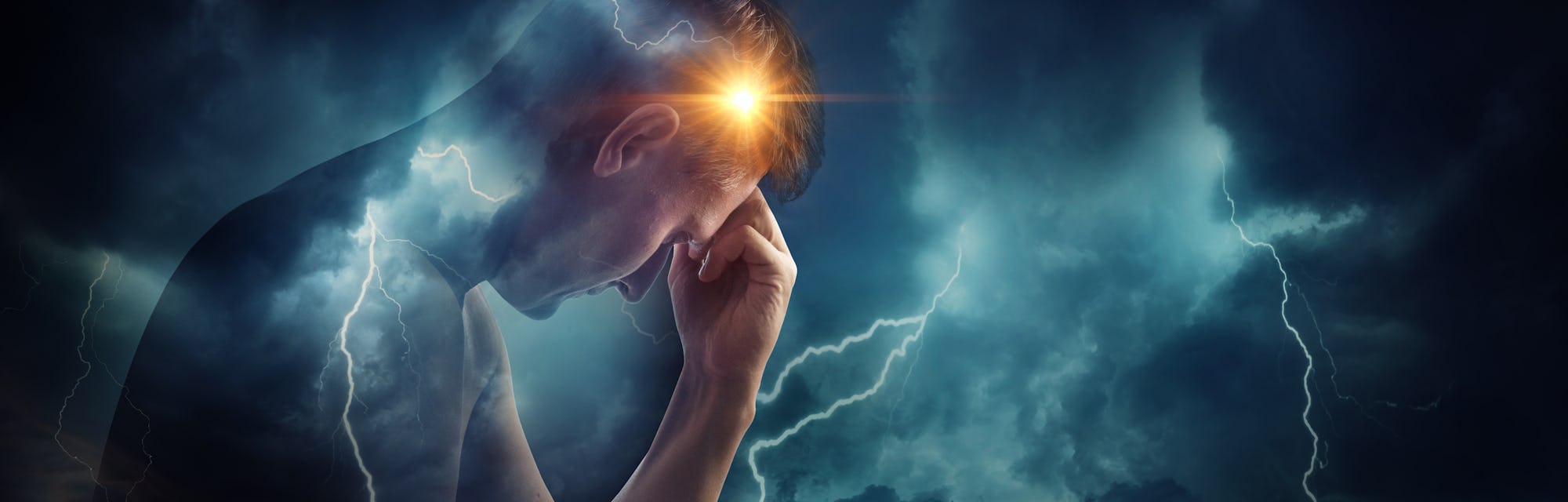 Storm sky with lightning and sun on the background of the silhouette of a man. Concept on the proble...