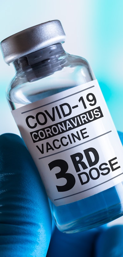 doctor with Coronavirus vaccine bottle with the name of the Third vaccine on the label. COVID-19 Vac...