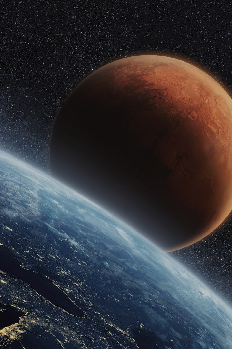 Blue planet earth with lights of night cities, view from space. Red Planet Mars in the starry sky. T...