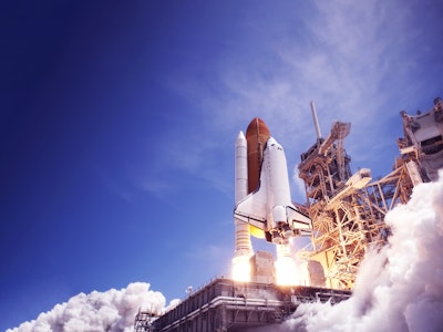The launch of the space shuttle against the sky, fire and smoke. Elements of this image were furnish...
