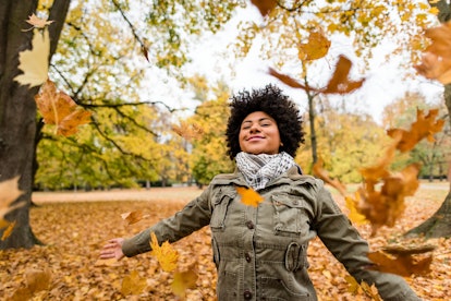 African american woman enjoying autumn season