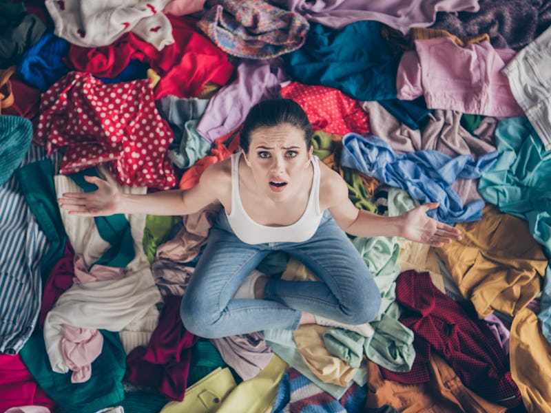 High angle above view photo of stressed helpless lady stay home spring cleaning household sit many c...