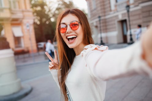 One of fall 2021's top hair color trends is the warm cinnamon brown shade seen here.