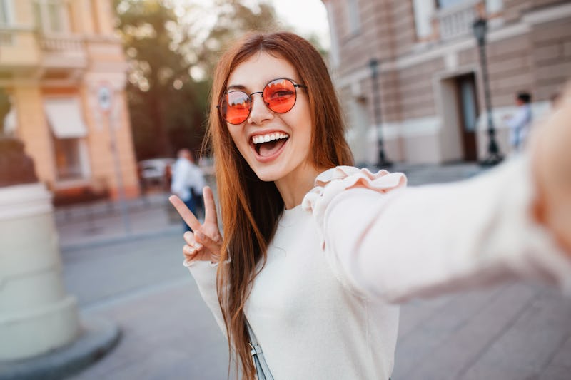 One of fall 2021's top hair color trends is the warm cinnamon brown shade seen here.