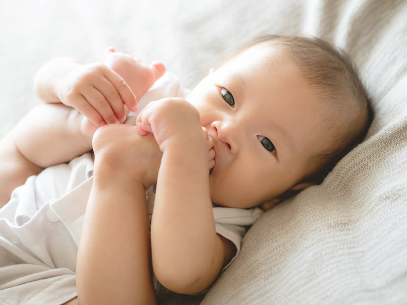 Closeup adorable infant Asian baby girl  