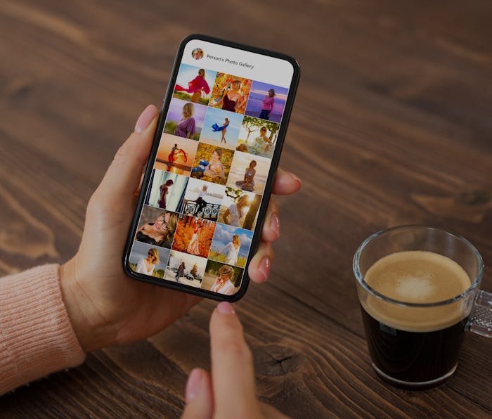 Woman browsing photos on social media app, person's name on screen is made up