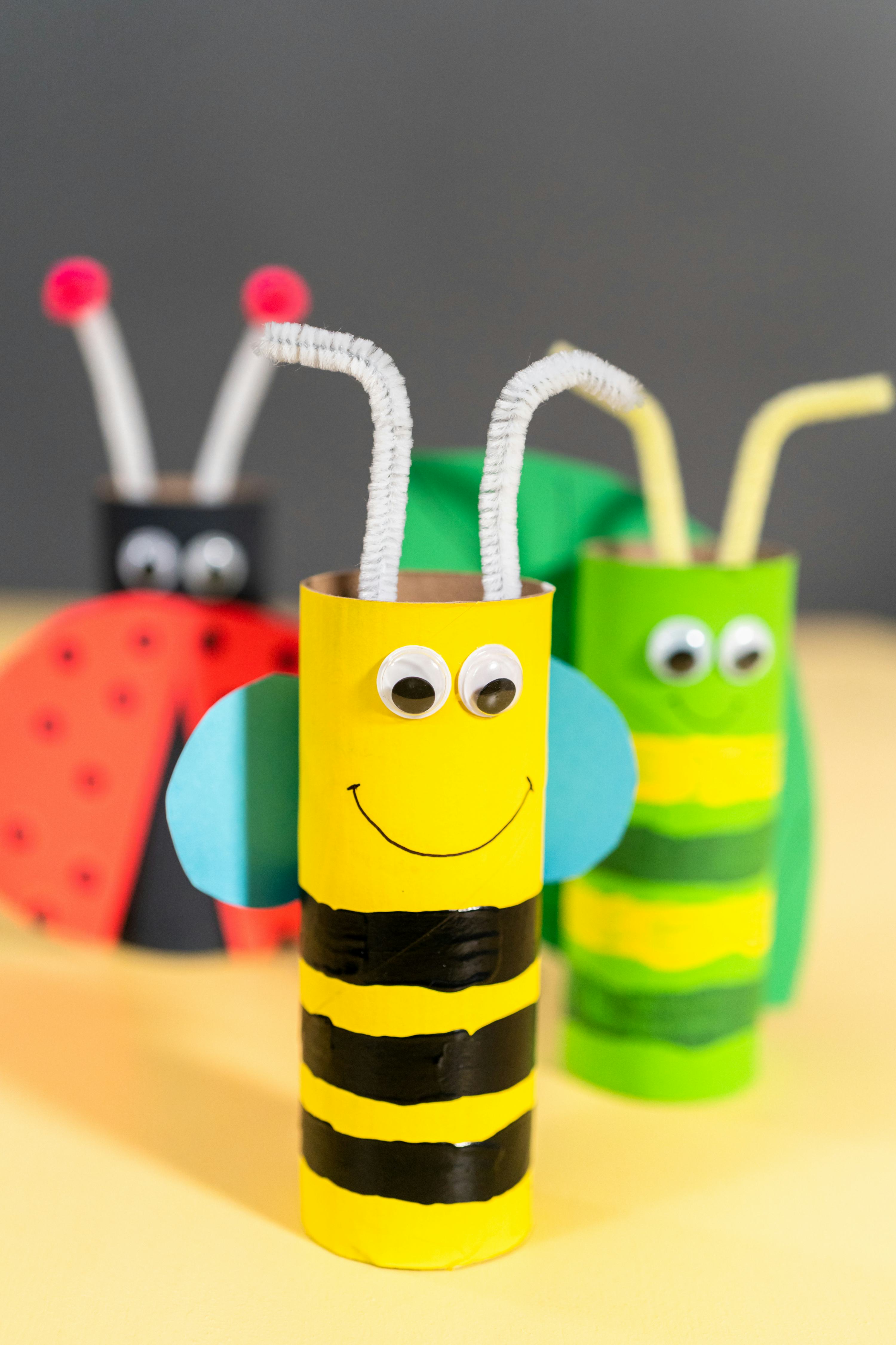 Papercraft project. Colorful bugs made out of empty toilet rolls.