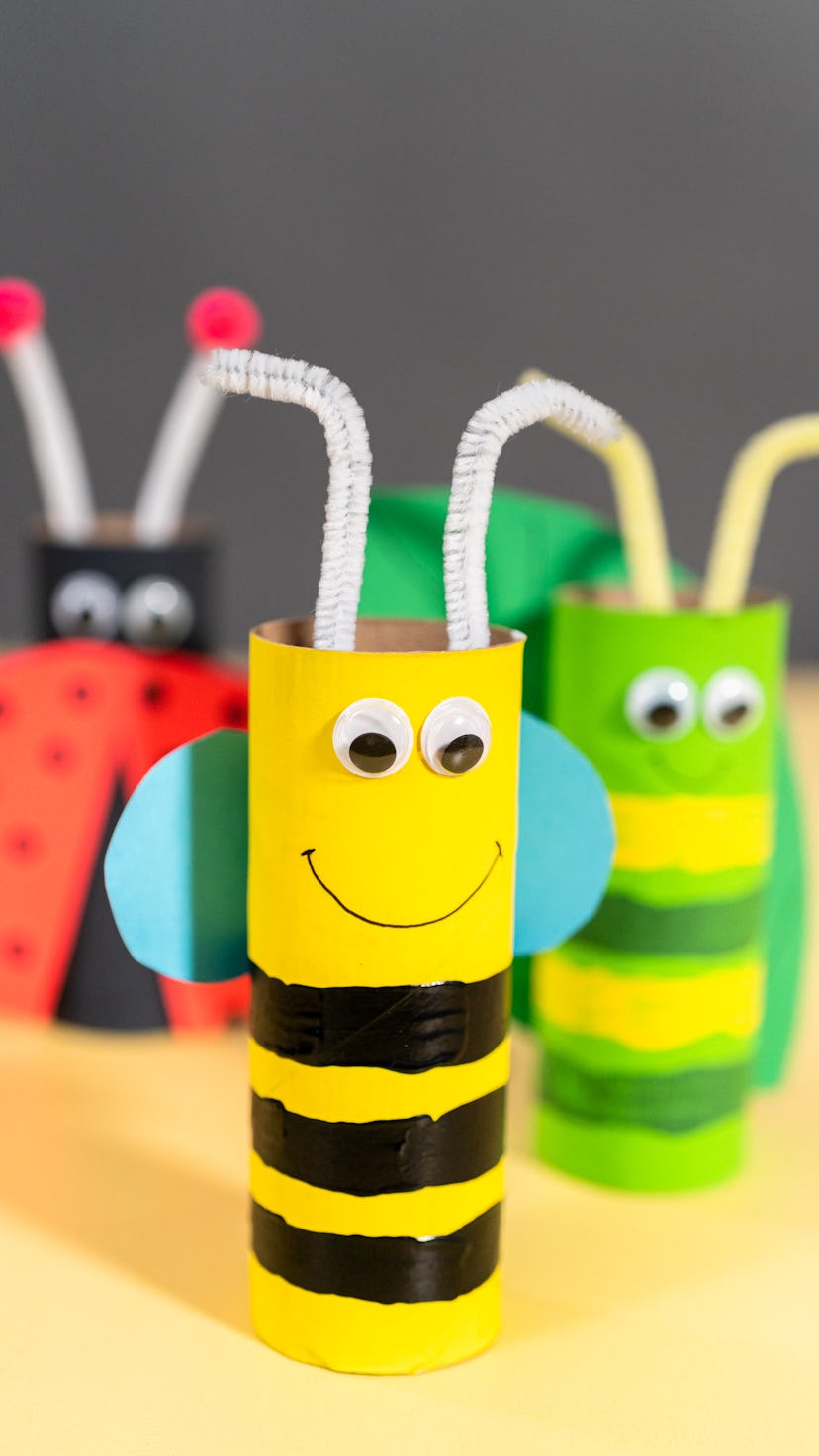 Papercraft project. Colorful bugs made out of empty toilet rolls.