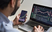 Business man trader investor analyst using mobile phone app analytics for cryptocurrency financial m...