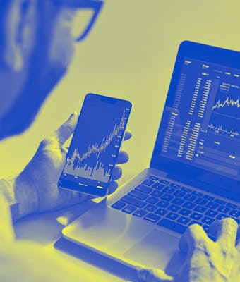 Business man trader investor analyst using mobile phone app analytics for cryptocurrency financial m...